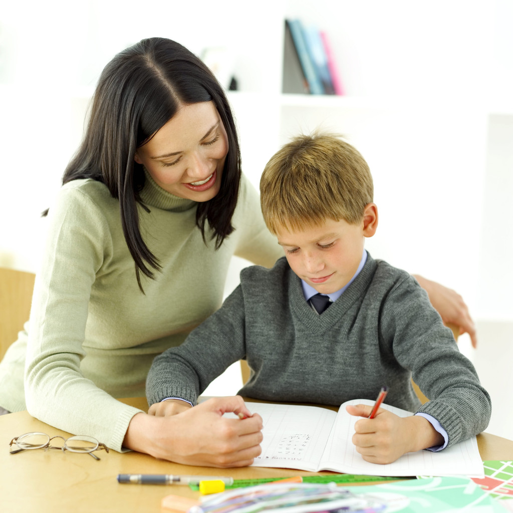 Young Boy Being Tutored by His Teacher